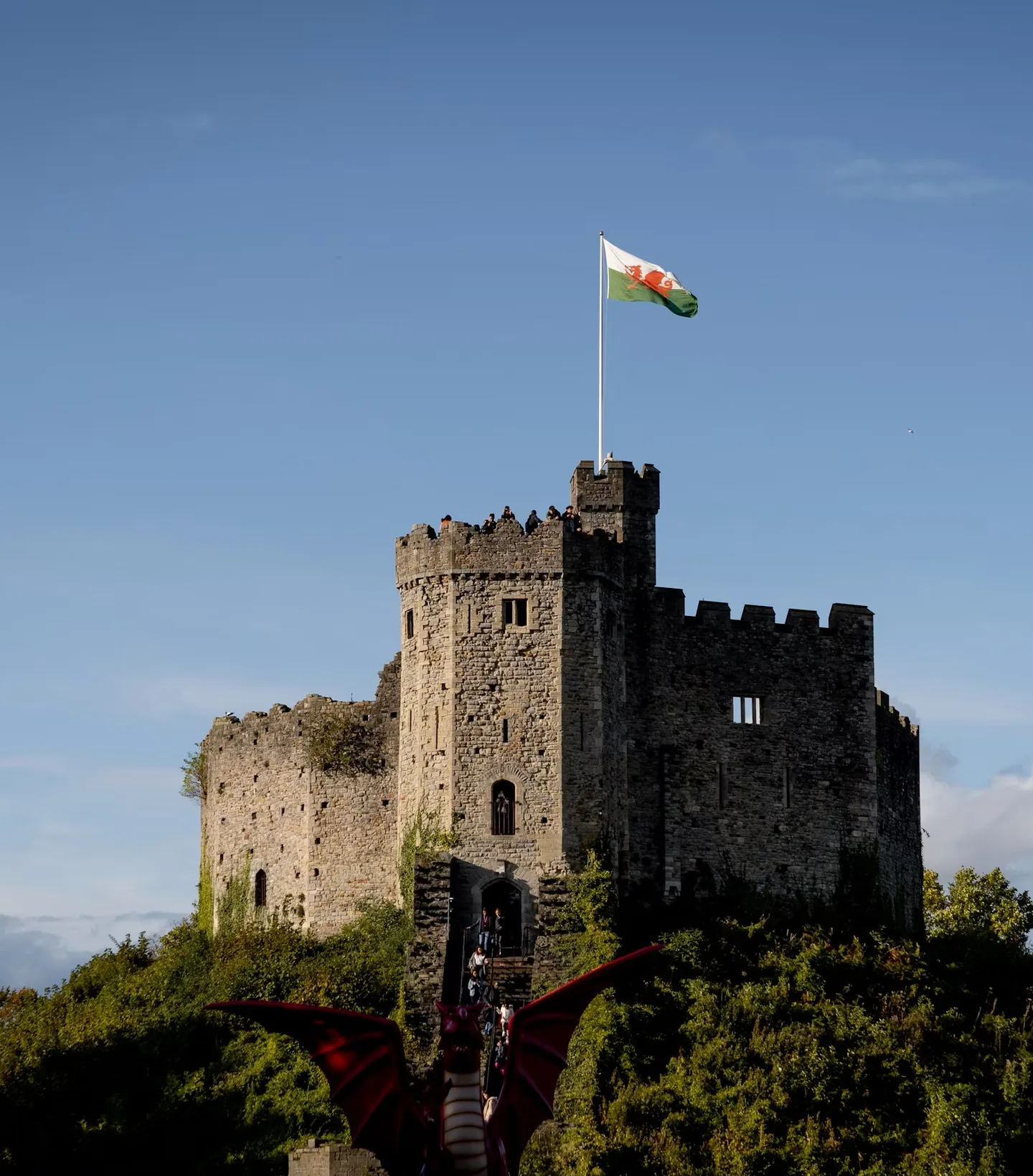 The keep at Cardiff Castle with the Welsh flag flying above it